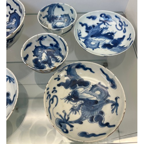 1229 - Selection of Antique Chinese blue and white dragon design cups and saucers, matching bowl, one other... 