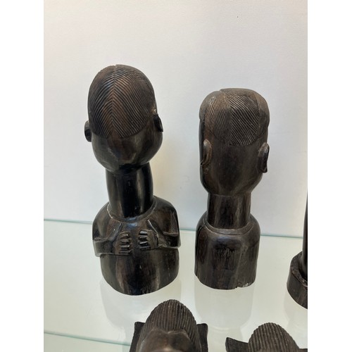 1238 - Selection of African hand carved tribal studies; mother carrying water pot on her head and child on ... 