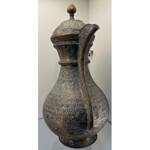 1239 - Early 19th century Bukhara or Turkestan coffee pot, copper worked and brass worked handle. [37cm hig... 