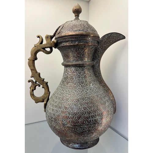 1239 - Early 19th century Bukhara or Turkestan coffee pot, copper worked and brass worked handle. [37cm hig... 