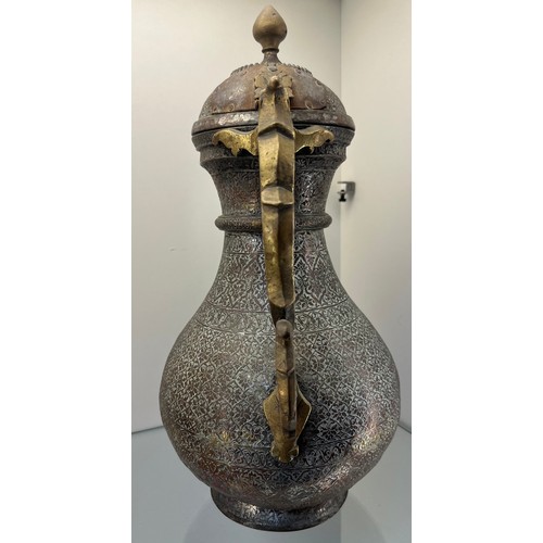 1239 - Early 19th century Bukhara or Turkestan coffee pot, copper worked and brass worked handle. [37cm hig... 