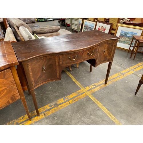 937 - Antique Mahogany serpentine front sideboard, supported on square tapered legs.