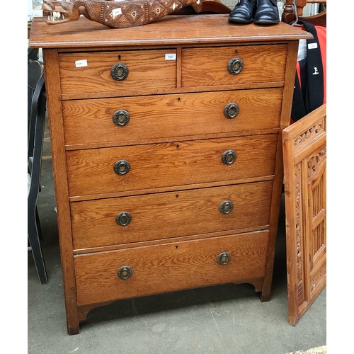 950 - Antique oak two over four chest of drawers with ornate swing handles