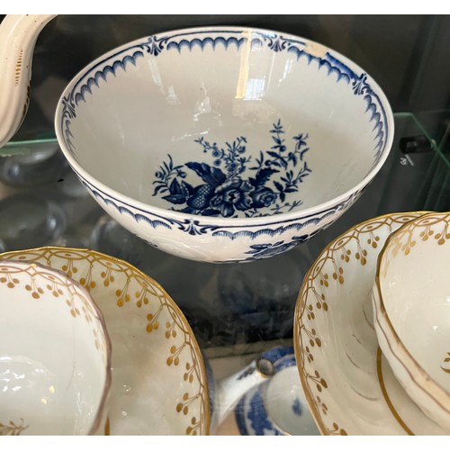 1361 - Two shelf of 19th century porcelain; Possible Worcester blue and white Willow pattern cups and sauce... 