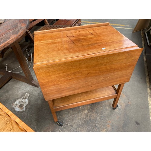 970 - Edwardian inlaid floral design drop end side table of two tiers. Together with a light wood trolley ... 