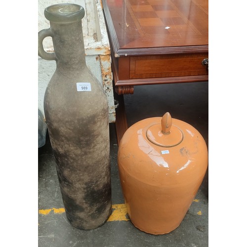 989 - Large interior design bottle together with an orange glazed temple jar and lid.