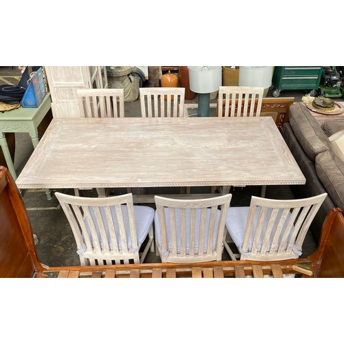 978 - Contemporary white washed dining table and six matching chairs (damage to the base)