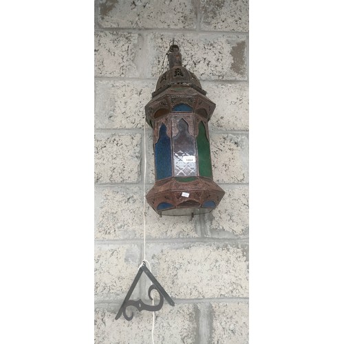 1064 - Indian metal worked and stainglass lantern