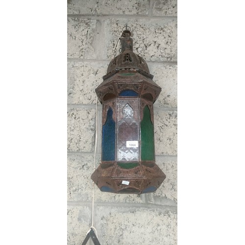 1064 - Indian metal worked and stainglass lantern