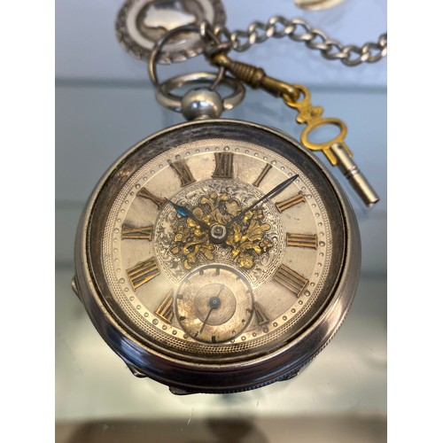 730A - Antique silver plated ornate pocket watch, Chester silver fob and silver plated albert chain. [Needs... 