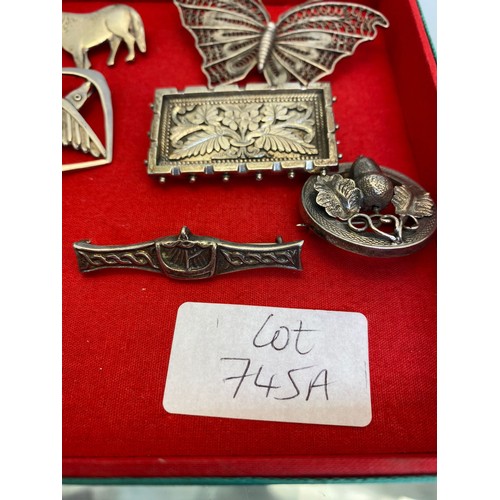 745A - Selection of Silver brooches; 925 Kris dagger tie clip, Victorian silver rectangle floral design bro... 