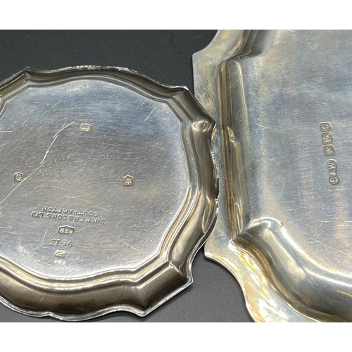 1149 - Two Sheffield silver dishes; Small ornate trimmed card tray and smaller ring tray. [208.42grams]