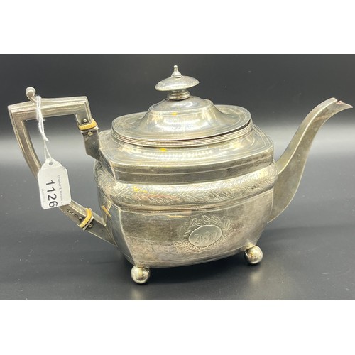 1126 - A 19th century London silver tea pot, [656grams]