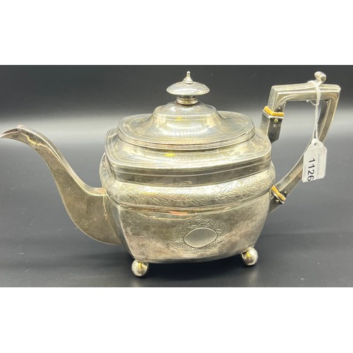 1126 - A 19th century London silver tea pot, [656grams]