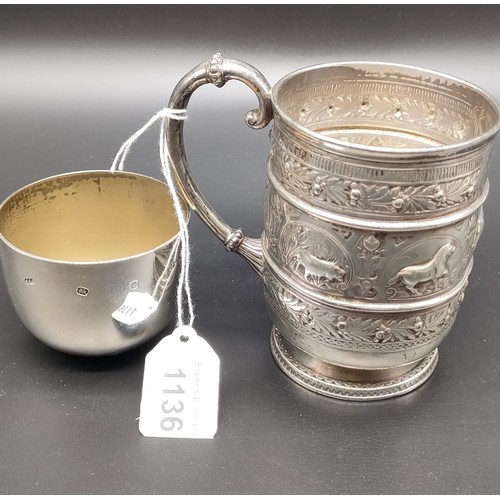 1136 - Victorian Glasgow silver drinking cup with handle; highly decorative showing raised relief African a... 