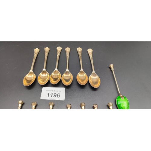 1196 - A Set of eight Birmingham silver and enamel coffee spoons with a gilt finish. Together with a set of... 