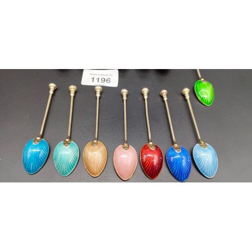 1196 - A Set of eight Birmingham silver and enamel coffee spoons with a gilt finish. Together with a set of... 