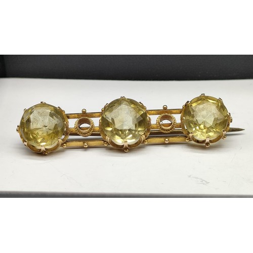 1207 - Antique 14ct yellow gold bar brooch set with three round cut citrine stones. [7.31grams]