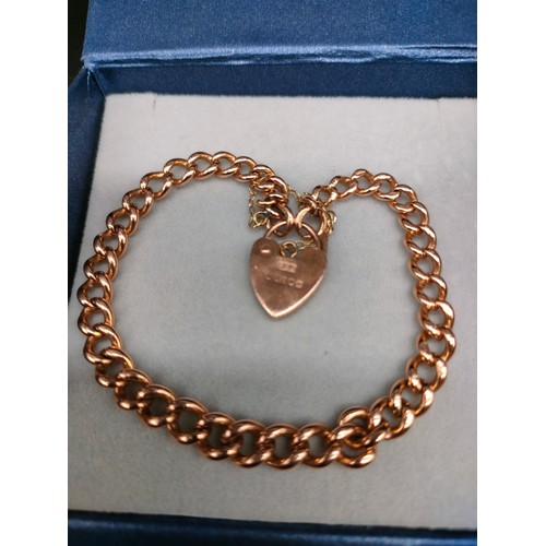 1110 - Antique 9ct yellow gold albert chain bracelet fitted with a 9ct yellow gold heart locket. [16.58gram... 