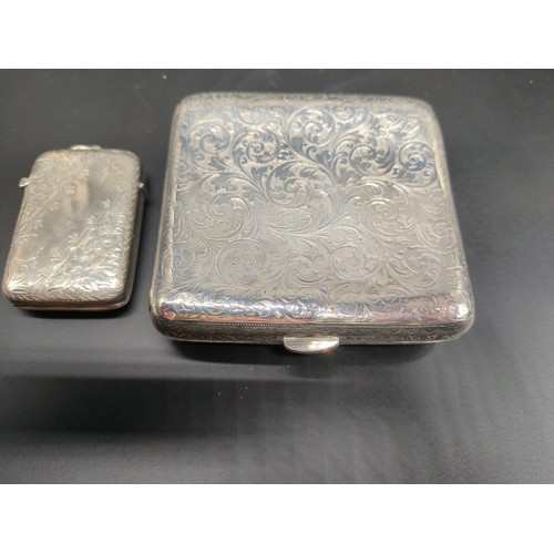 1115 - London silver ornate cigarette case together with a Birmingham silver vesta case. [163.80grams]