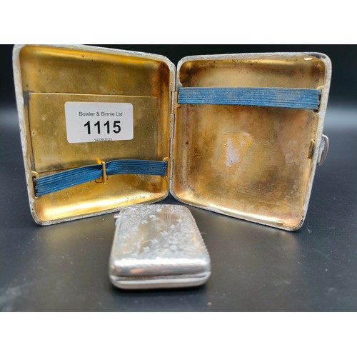 1115 - London silver ornate cigarette case together with a Birmingham silver vesta case. [163.80grams]