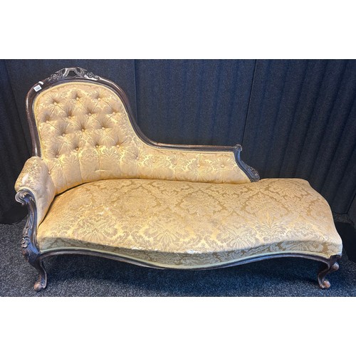 1334 - 19th century Victorian chaise longue, the shaped button back above a cushioned seat, raised on short... 