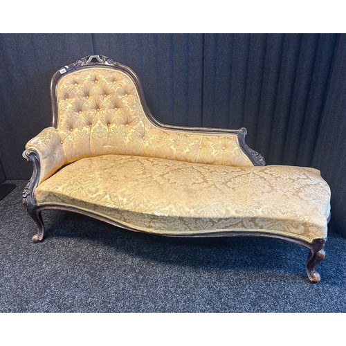 1334 - 19th century Victorian chaise longue, the shaped button back above a cushioned seat, raised on short... 