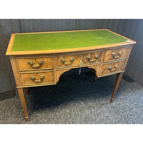 1333 - 19th century knee hole desk, the leather surface above a bow front arrangement of drawers, raised on... 