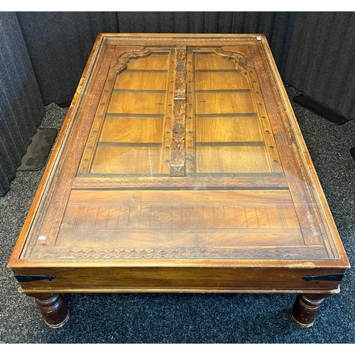 1681 - A Large Hardwood Rustic Indian Door upcycled into a lounge table. Has a fitted Glass insert top. [41... 