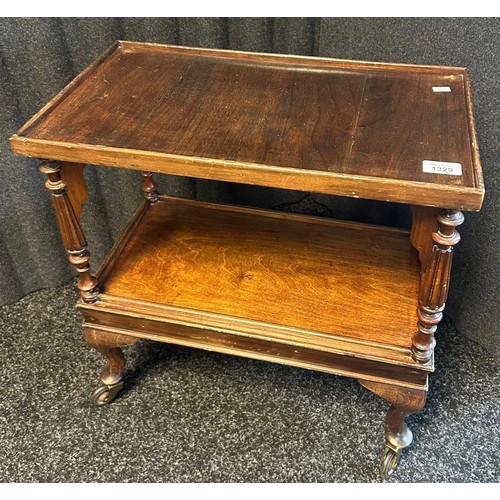 1329 - 19th century trolley table, the two surfaces separated by turned columns, raised on cabriole legs en... 