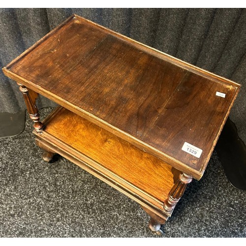 1329 - 19th century trolley table, the two surfaces separated by turned columns, raised on cabriole legs en... 