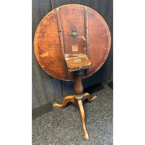 1331 - 19th century tilt top table, the circular surface above a turned pedestal and three cabriole legs [7... 