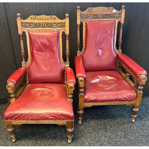 1349 - A pair of 19th century Oak his and her oak arm chairs, carved top sections, leading to turned column... 