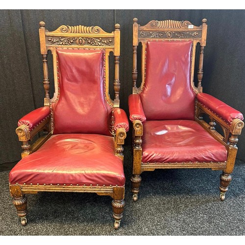 1349 - A pair of 19th century Oak his and her oak arm chairs, carved top sections, leading to turned column... 