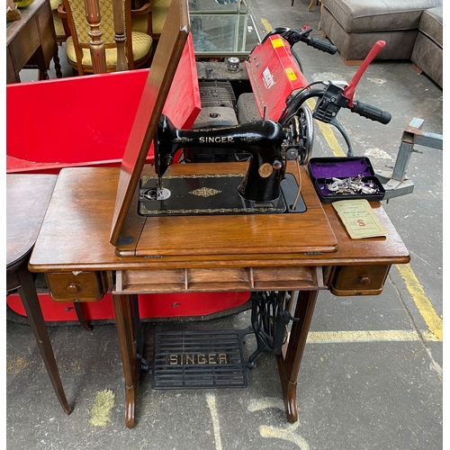 999A - Antique singer sewing machine on wooden support stand and accessories