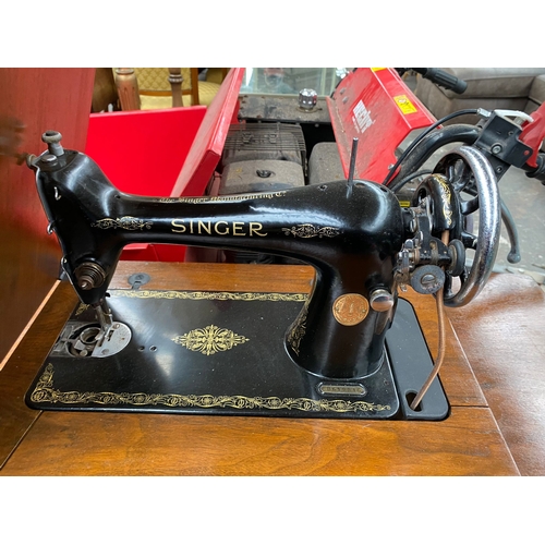 999A - Antique singer sewing machine on wooden support stand and accessories