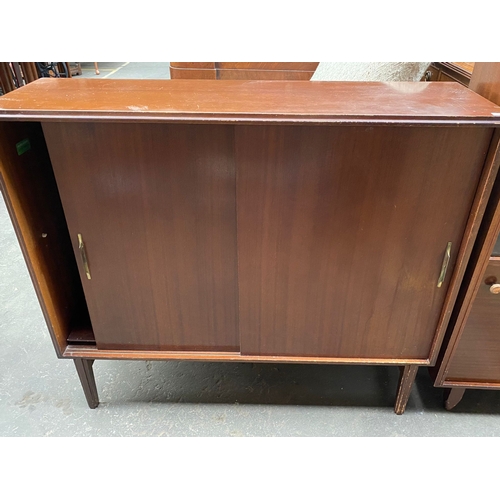 996A - 2 mid century sliding door book cases includes beavley and tapley ltd