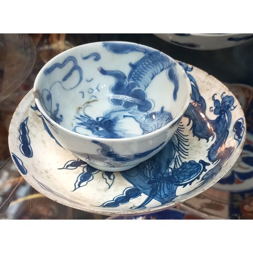 1229 - Selection of Antique Chinese blue and white dragon design cups and saucers, matching bowl, one other... 