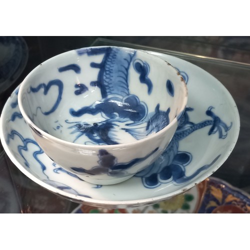 1229 - Selection of Antique Chinese blue and white dragon design cups and saucers, matching bowl, one other... 