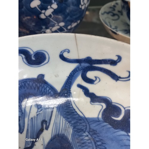 1229 - Selection of Antique Chinese blue and white dragon design cups and saucers, matching bowl, one other... 