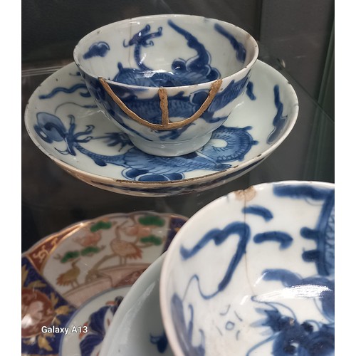 1229 - Selection of Antique Chinese blue and white dragon design cups and saucers, matching bowl, one other... 