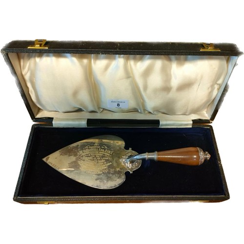 8 - Glasgow silver and walnut handled presentation trowel. Comes with box. [30cm in length] [224grams]