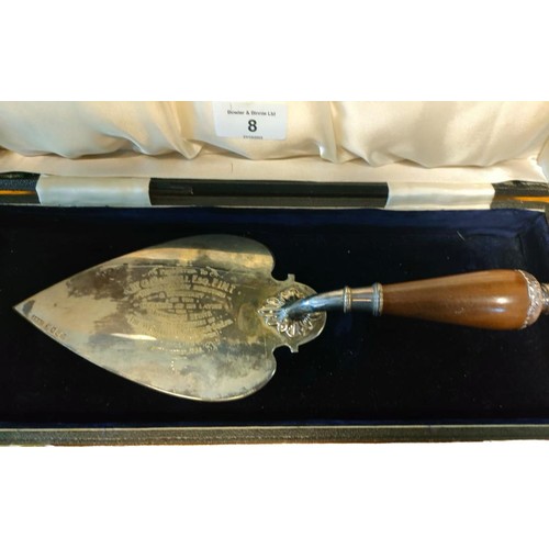 8 - Glasgow silver and walnut handled presentation trowel. Comes with box. [30cm in length] [224grams]