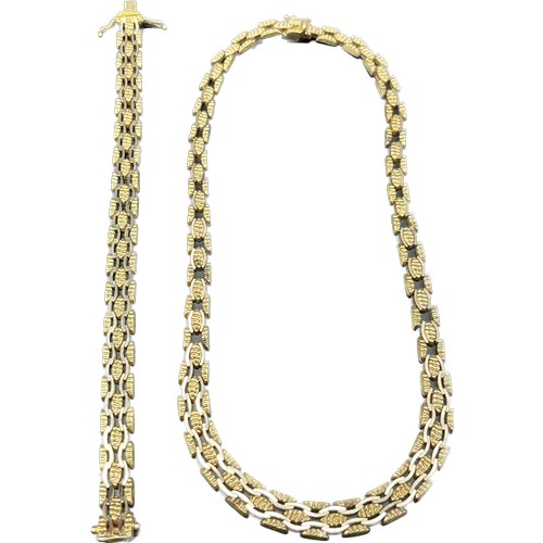 19 - 9ct yellow gold unusual linked necklace and matching bracelet. [44.06grams]