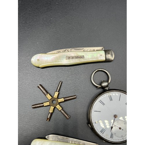 123A - Silver Pocket watch, Two silver and mother of pearl fruit knives and pocket watch key.