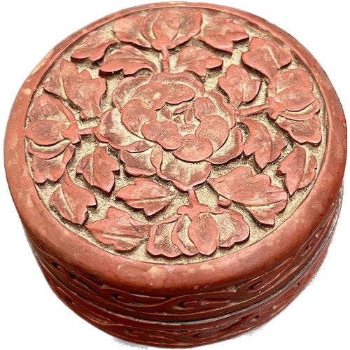 660 - Small Antique Chinese Red lacquered Cinnabar floral design lidded ink pot. [6cm diameter]