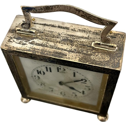 565 - 1920's Birmingham silver clock. Swing handle, square form and raised on bun feet. [9x8x3.5cm]