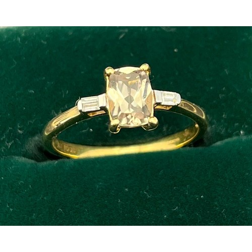 13 - 10ct yellow gold ladies ring set with a blue spinel stone flanked by diamond shoulders. [Ring size P... 