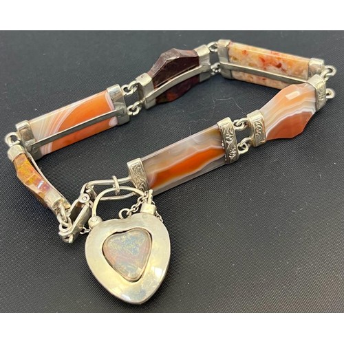 546 - A Victorian silver and agate set bracelet
With shaped agates within engraved mounts, padlock clasp l... 