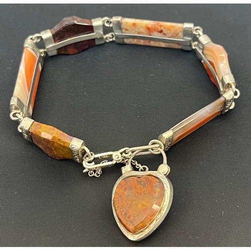 546 - A Victorian silver and agate set bracelet
With shaped agates within engraved mounts, padlock clasp l... 